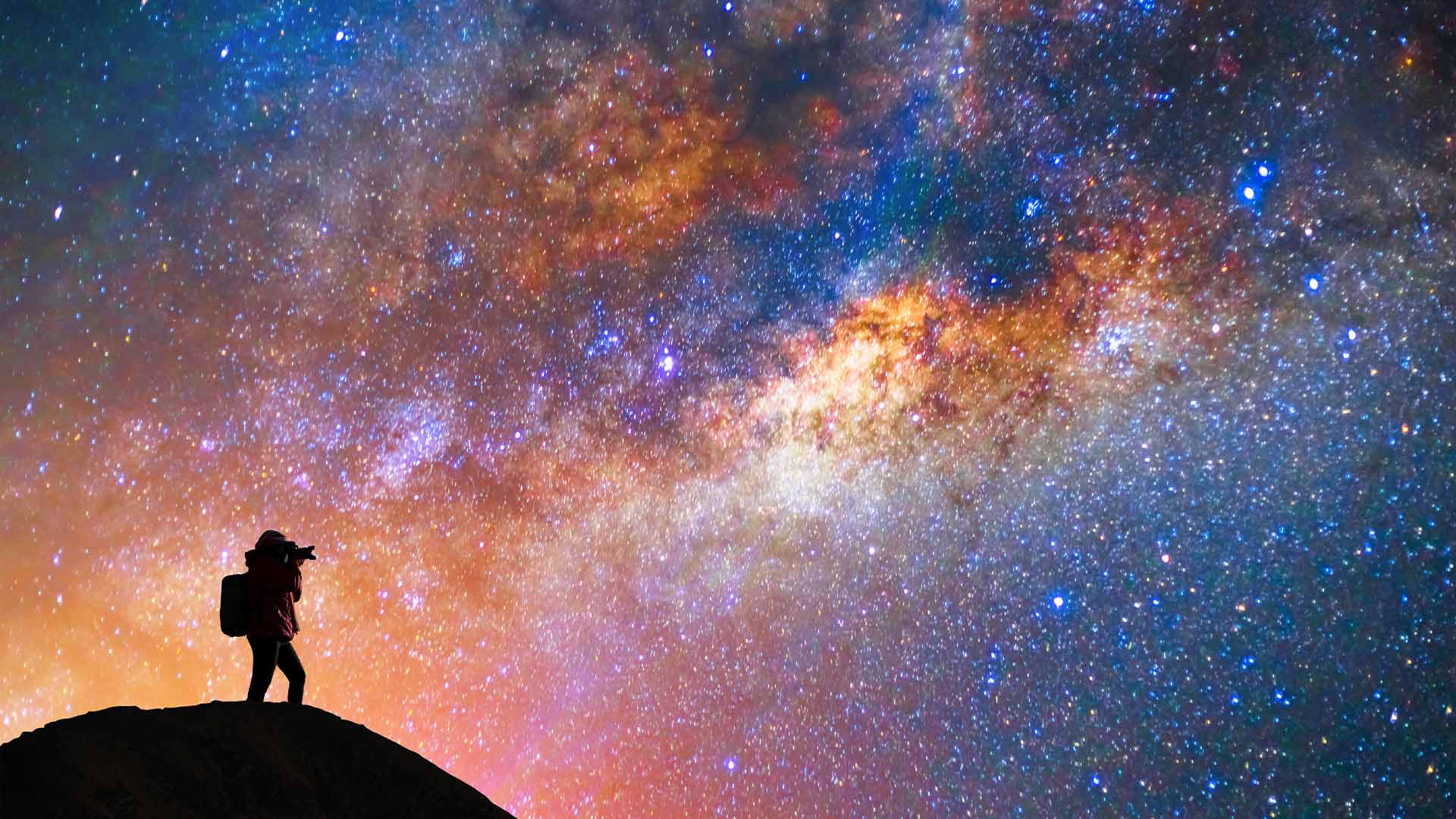 Silhouette of a photographer capturing the Milky Way—faith and wonder explored on How I Know God Is Real.